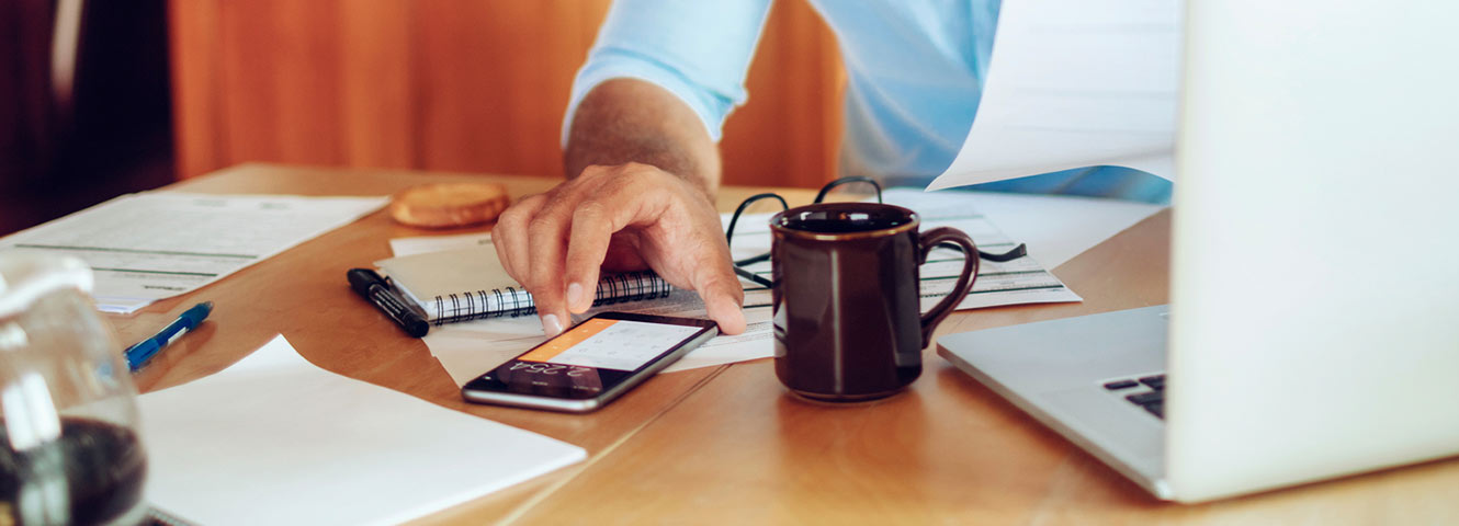 Man using phone calculator.