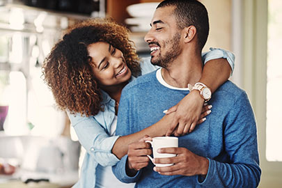 Young couple in kitchen.